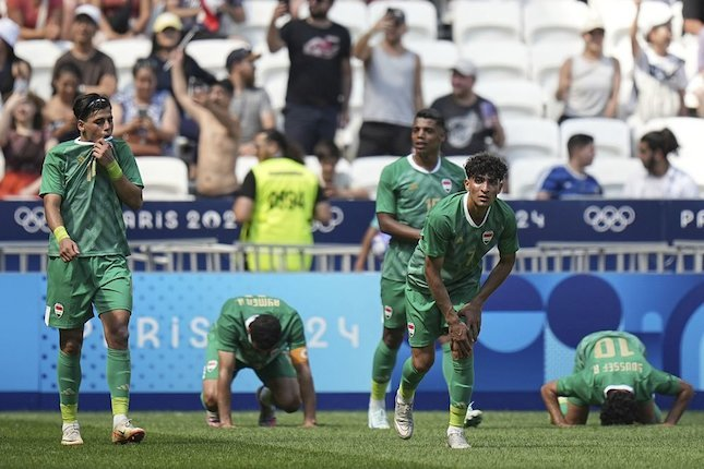 Olimpiade Paris 2024: Selebrasi pemain-pemain Irak (c) AP Photo/Laurent Cipriani